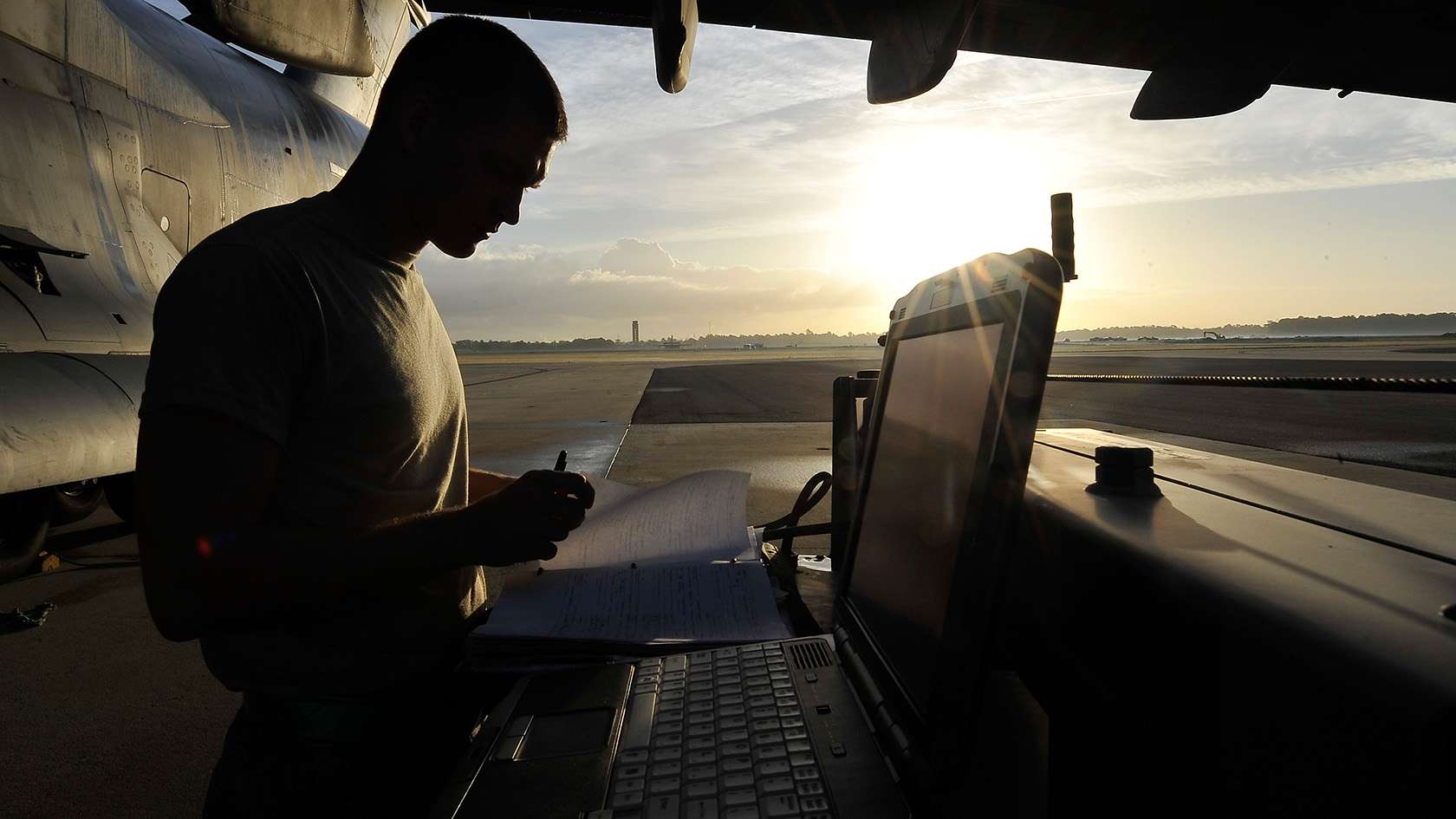 airman working to troubleshoot aircraft electrical system 